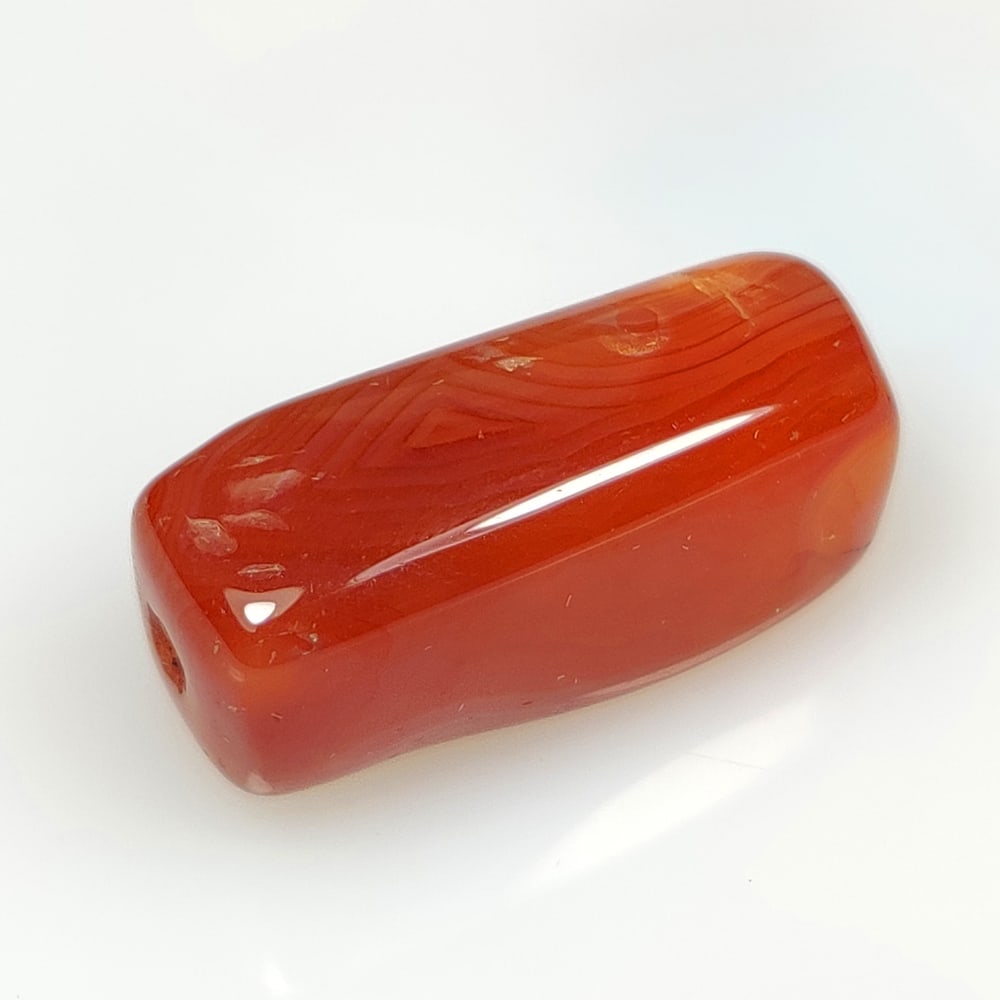 29.51 Ct Natural Orange Carnelian Drilled Dumble cab: Weight - 29.51 Ct / Dimensions - 25.00 x 11.90 x 10.40 mm / Shape & Cut - Drilled Dumble Cab / Transparency - Semi - Transparent / Origin - Brazil