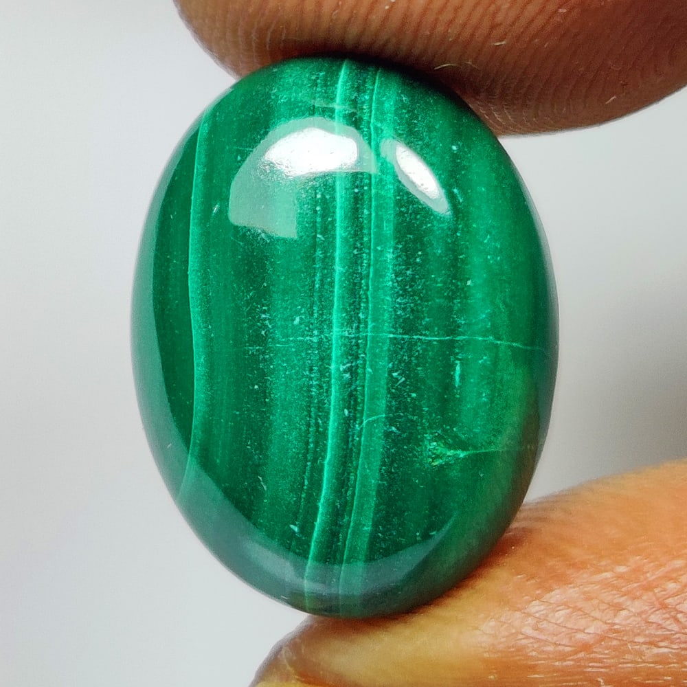12.45 Ct Natural Green Malachite Oval Cab: Weight - 12.45 Ct / Dimensions - 16.30 x 12.20 x 5.20 mm / Shape - Oval Cab / Color - Green / Clarity - Opaque / Origin - Russia / Treatment - None