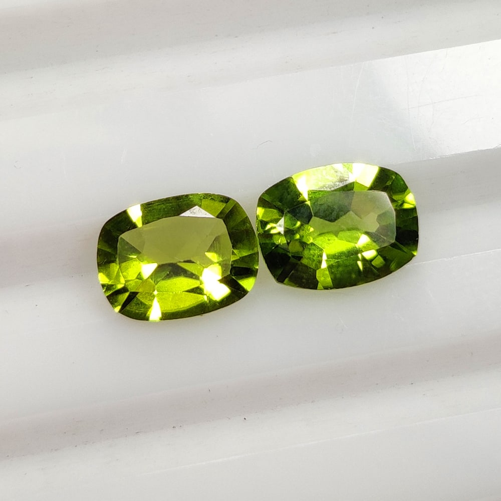 2.62 Ct Natural Green Peridot Cushion Cut Pair: Weight - 2.62 Ct / Dimensions - 8.20 x 6.20 x 3.90 mm / 2 Pc's / Shape - Cushion Cut / Color - Green / Clarity - SI / Origin - Pakistan / Treatment - None