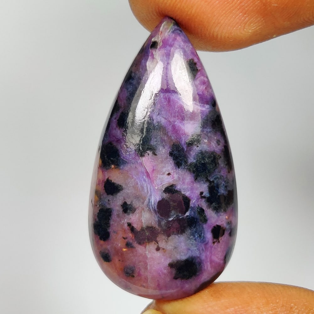 26.47 Ct Natural Purple Charoite Pear Cab: Weight - 26.47 Ct / Size - 33.00 x 17.50 x 6.10 mm / Shape - Excellent Pear Cab / Clarity - Opaque / Origin - Brazil / Treatment - None