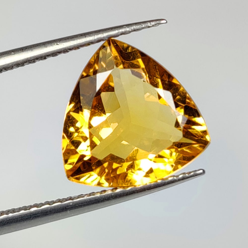 3.35 Ct Natural Yellow Citrine Trillion Cut: Weight - 3.35 Ct / Dimensions -10.90 x 10.90 x 5.50 mm / Shape - Trillion Cut / Color - Yellow / Clarity - VVS / Origin - Brazil / Treatment - Heated