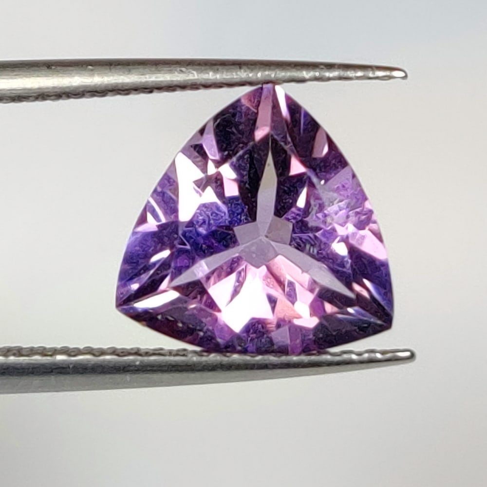2.67 Ct Natural Purple Amethyst Trillion Cut: Weight - 2.67 Ct / Dimensions -9.90 x 9.90 x 5.90 mm / Shape - Trillion Cut / Color - Purple / Clarity - VVS / Origin - Brazil / Treatment - Heated
