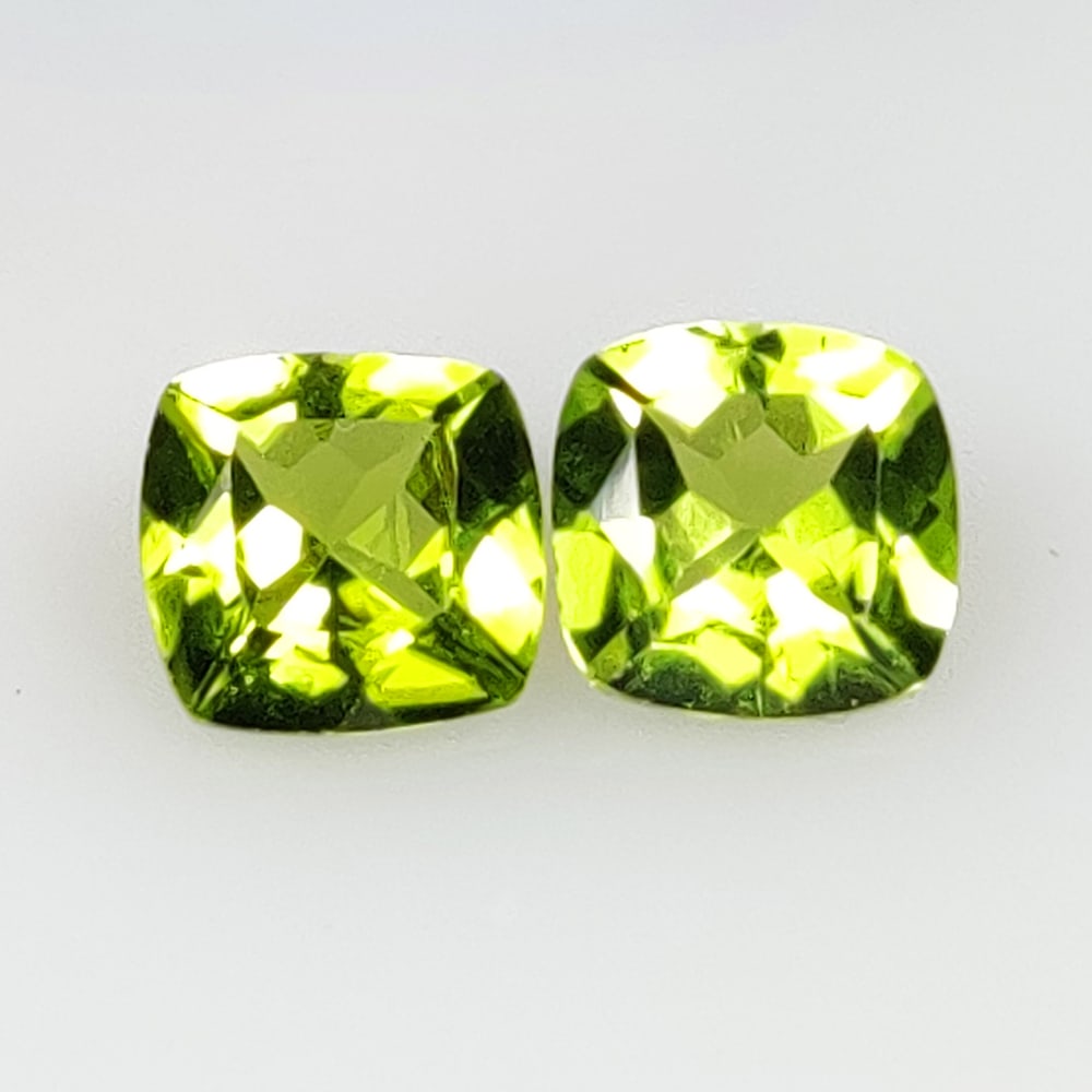 2.73 Ct Natural Green Peridot Cushion Cut Pair: Weight - 2.73 Ct / Size - 7.00 x 6.90 x 3.90 mm / 2 Pc's / Shape - Cushion Cut / Color - Green / Clarity - VVS / Origin - Pakistan / Treatment - None