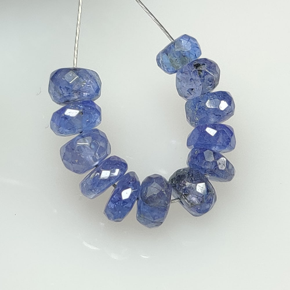 7.36 Ct Natural Tanzanite Round Cut Beads: Weight : 7.36 Ct / Dimensions : 4.20 - 4.80 mm / 12 Pc's / Shape : Round Cut Beads / Color : Purplish Blue / Transparency : Transparent / Treatment : Heated