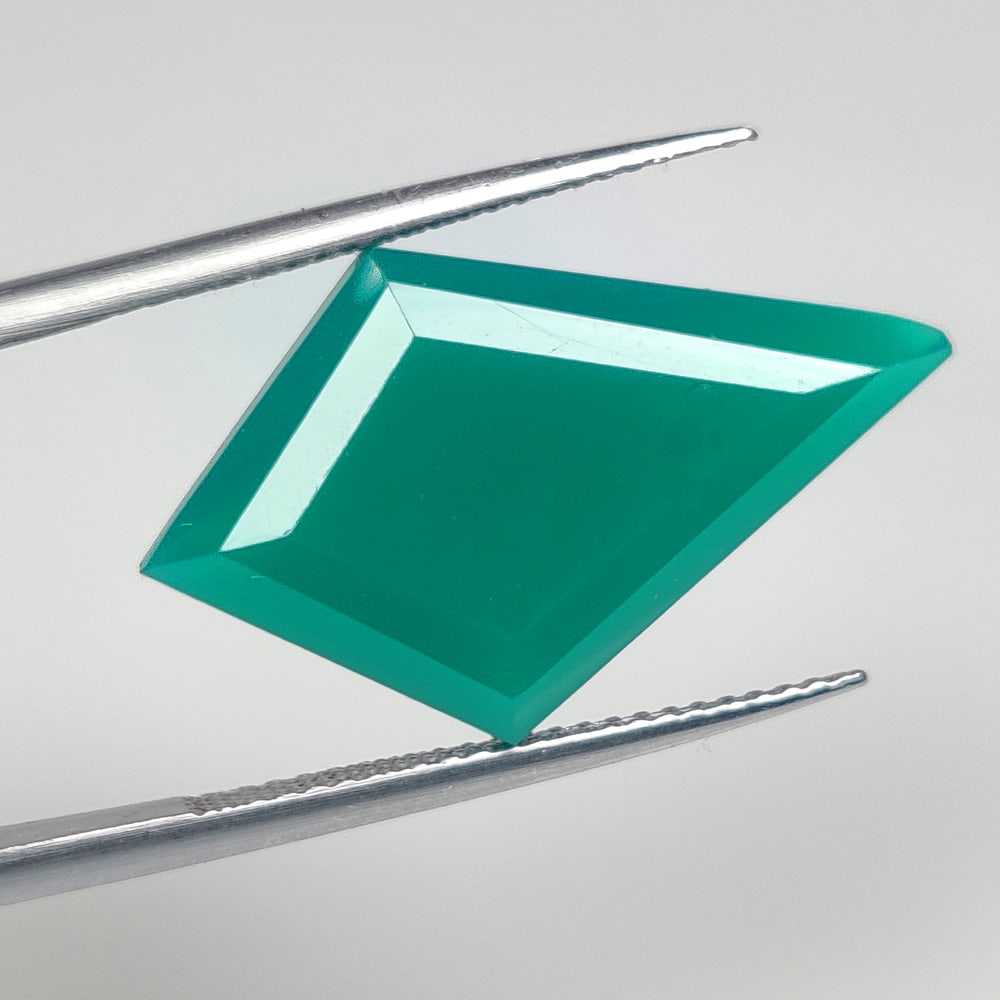 9.70 Ct Natural Green Onyx Fancy Cut: Weight - 9.70 Ct / Dimensions -25.00 x 14.50 x 6.20 mm / Shape - Fancy Cut / Clarity - Semi Transparent / Origin - Brazil / Treatment - None