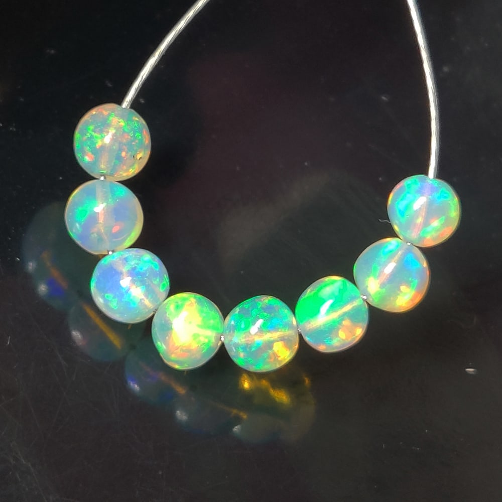 3.73 Ct Natural Multicolor Welo Opal Top Fire  Round Beads (1 of 2)