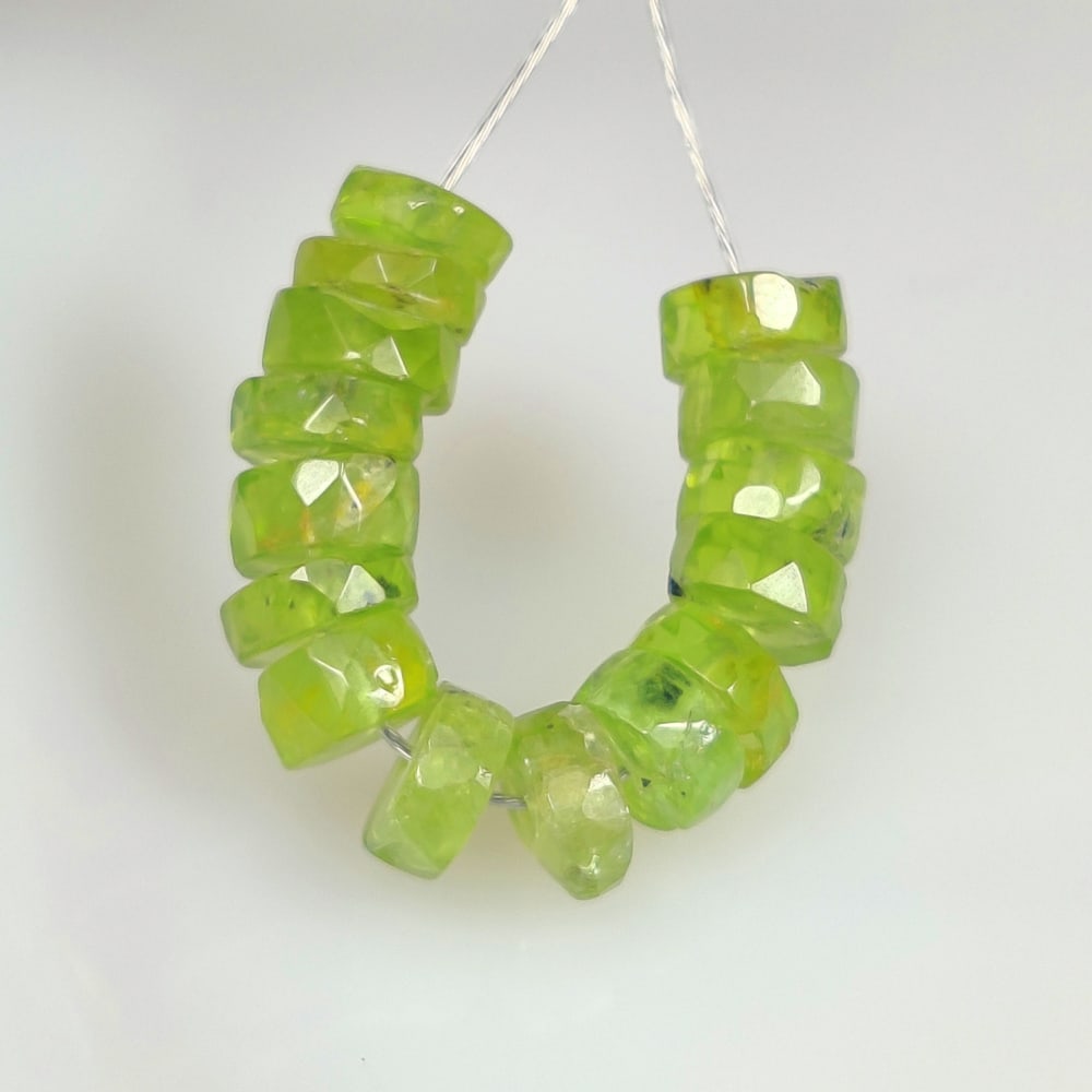 15.13 Ct Natural Green Peridot Round Cut Beads: Weight - 15.13 Ct / Size - 5.60 - 6.10 mm / 15 Pc's / Shape - Round Cut Beads / Color - Green / Clarity - VVS / Origin - Pakistan / Treatment - None