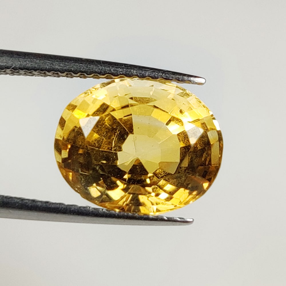 4.06 Ct Natural Yellow Citrine Oval Cut: Weight - 4.06 Ct / Size - 11.00 x 9.00 x 7.40 mm / Shape - Oval Cut / Color - Yellow / Clarity - VVS / Origin - Brazil / Treatment - Heated