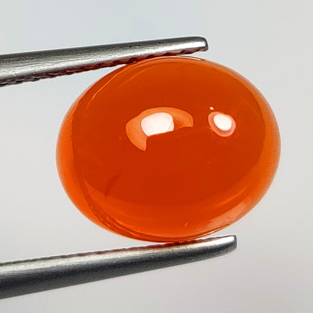 4.20 Ct Natural Orange Carnelian Oval cab: Weight - 4.20 Ct / Dimensions - 11.00 x 9.00 x 5.90 mm / Shape & Cut - Oval cab / Transparency - Semi - Opaque / Origin - Brazil