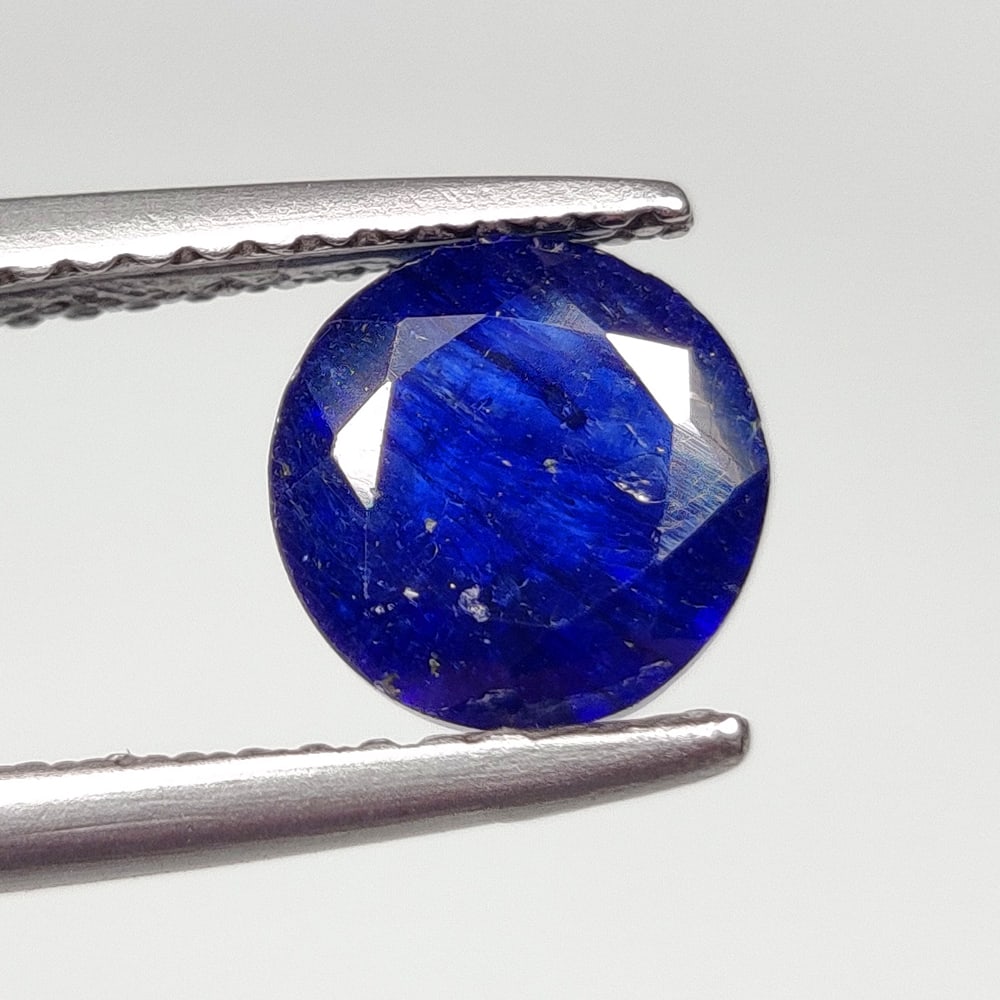 1.70 Ct Natural Blue Sapphire Round Cut: Weight - 1.70 Ct / Size- 7.00 x 7.00 x 3.70 mm / Shape - Round Cut / Clarity - SI / Origin - Sri Lanka / Treatment - Diffused