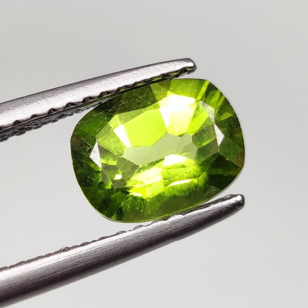 1.50 Ct Natural Green Peridot Cushion Cut: Weight - 1.50 Ct / Dimensions - 8.10 x 6.20 x 4.20 mm / Shape - Cushion Cut / Color - Green / Clarity - VVS / Origin - Pakistan / Treatment - None
