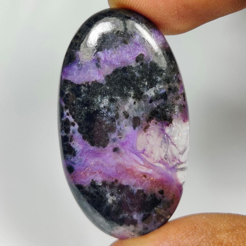53.40 Ct Natural Purple Charoite Oval Cab: Weight - 53.40 Ct / Size - 40.00 x 23.00 x 6.00 mm / Shape - Excellent Oval Cab / Clarity - Opaque / Origin - Brazil / Treatment - None