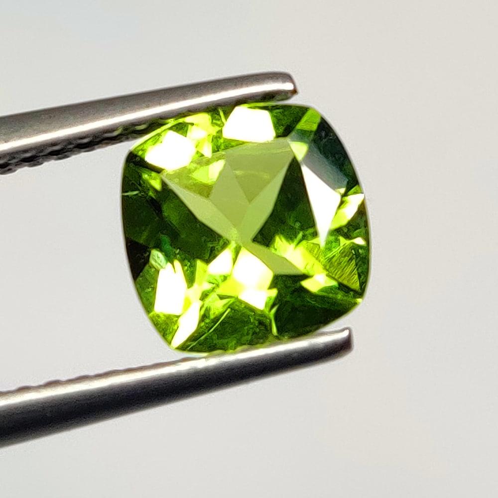 1.49 Ct Natural Green Peridot Cushion Cut: Weight - 1.49 Ct / Size - 7.20 x 7.20 x 4.20 mm / Shape - Cushion Cut / Color - Green / Clarity - VVS / Origin - Pakistan / Treatment - None
