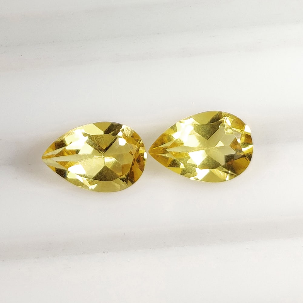 2.51 Ct Natural Yellow Citrine Pear Cut Pair: Weight - 2.51 Ct / Size - 9.10 x 6.30 x 4.30 mm / 2 Pc's / Shape - Pear Cut / Color - Yellow / Clarity - VVS / Origin - Brazil / Treatment - Heated