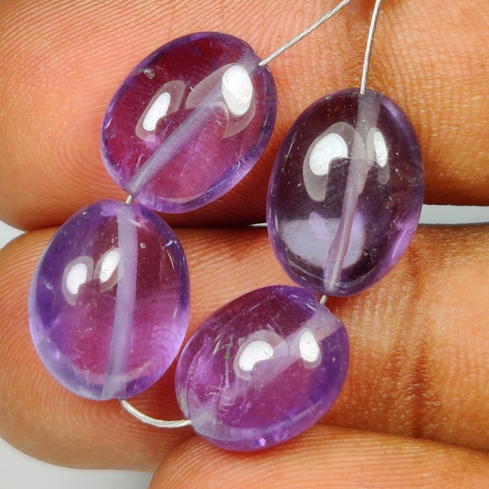 17.97 Ct Natural Purple Amethyst Dumble Beads: Weight - 17.97 Ct / Dimensions - 10.3x8.6 - 11.3x9.4 mm / 4 Pc's/ Shape - Dumble Beads / Color - Purple / Clarity - VVS / Origin -Brazil / Treatment - Heated