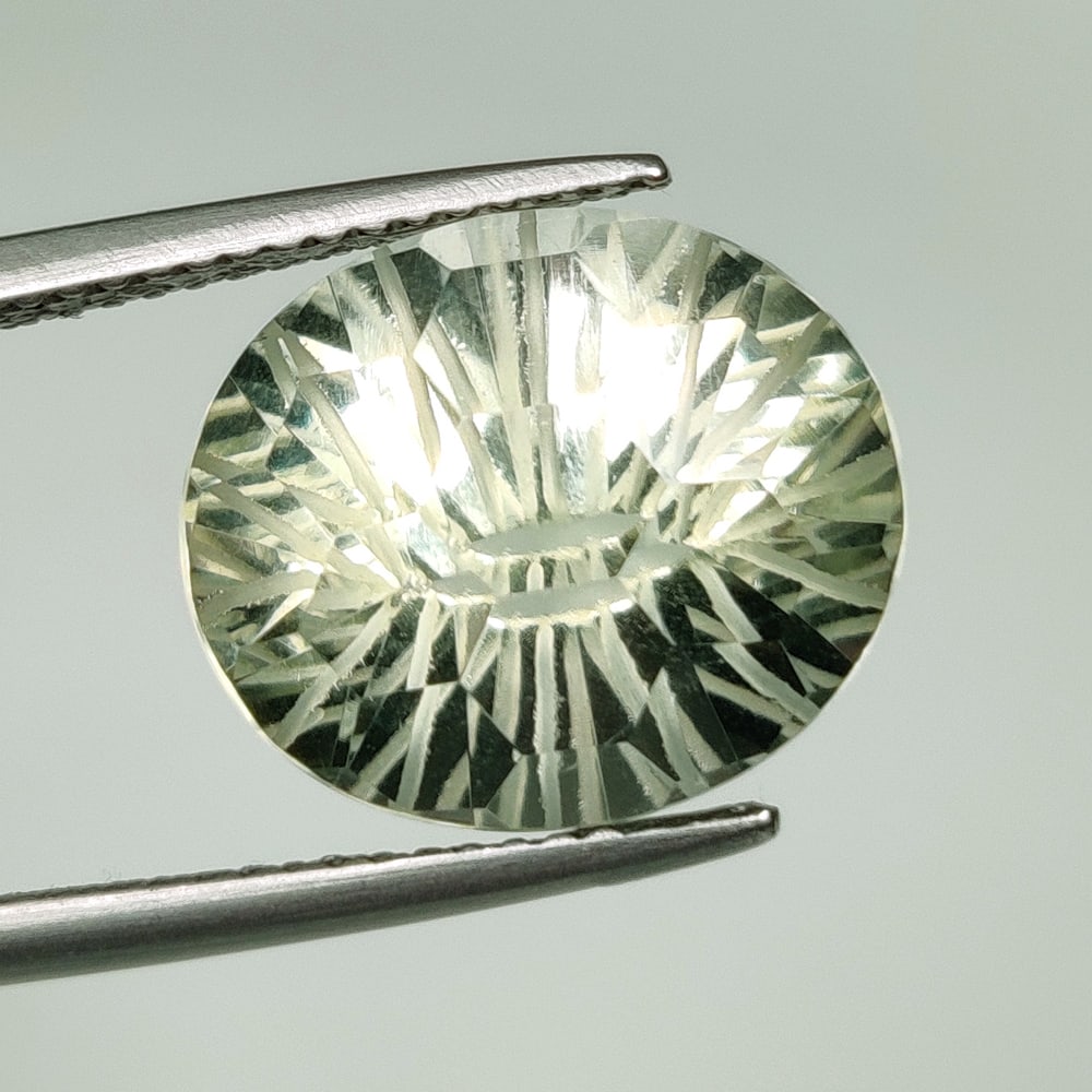 8.05 Ct Natural Green Amethyst Oval Football Cut: Weight - 8.05 Ct / Size - 14.00 x 12.00 x 9.30 mm / Shape - Oval Cut / Color - Green / Clarity - VVS / Origin - Brazil / Treatment - Heated