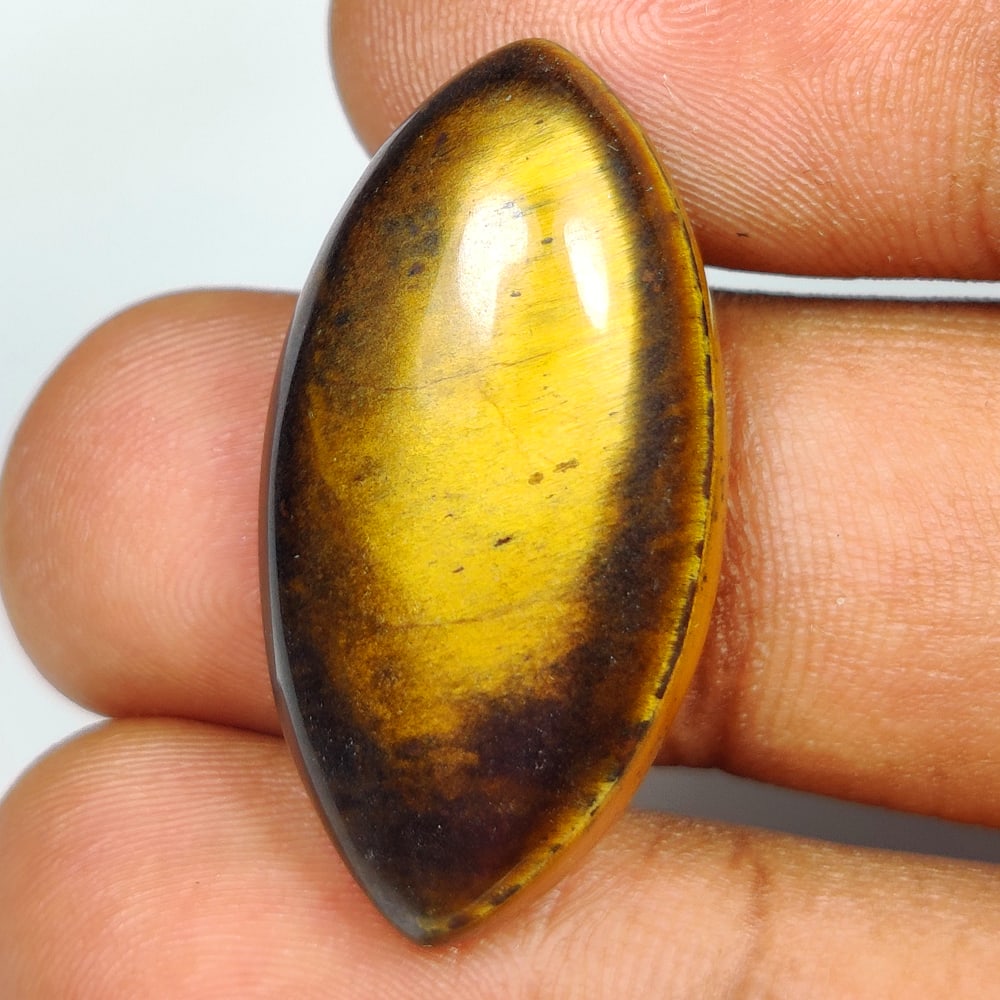 25.32 Ct Natural Tiger Eye Marquise Cab: Weight - 25.32 Ct / Dimensions - 31.00 x 16.00 x 7.00 mm / Top Class Quality / Marquise Cab / Origin - Burmese / Comments - None