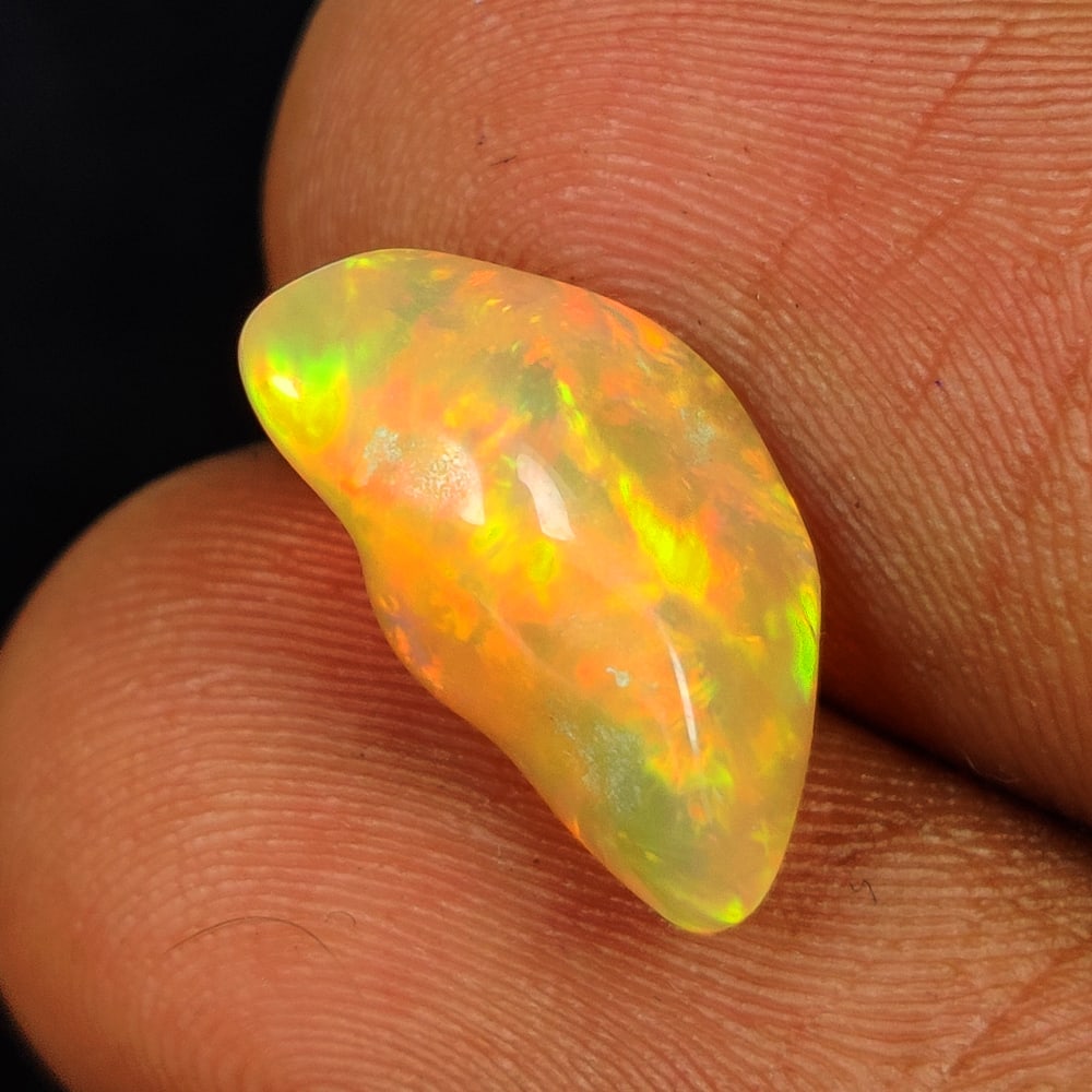 3.00 Ct Natural Multicolor Welo Opal Top Fire Solid Rough: Weight - 3.00 Ct / Size - 14.00 x 8.50 x 6.70 mm / Shape - Solid Rough Cab / Color - Multicolor / Clarity - Translucent / Origin - Ethiopia / Treatment - None
