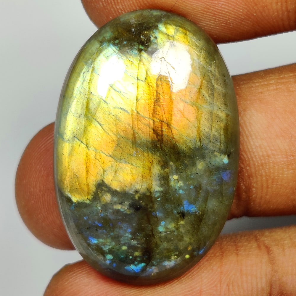 39.35 Ct Natural Labradorite Oval Cab: Weight - 39.35 Ct / Dimensions - 32.00 x 21.00 x 7.30 mm / Shape - Oval Cab / Clarity - Opaque / Origin - Africa / Treatment - None