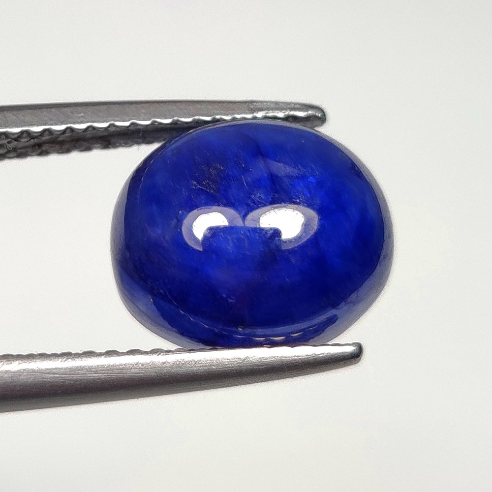 7.63 Ct Natural Blue Sapphire Oval Cab: Weight - 7.63 Ct / Size- 11.20 x 9.50 x 6.70 mm / Shape - Oval Cab / Clarity - SI / Origin - Sri Lanka / Treatment - Diffused