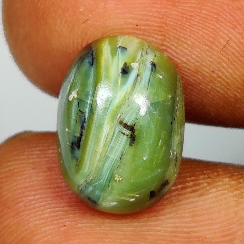 4.18 Ct Natural Opal Oval Cab: Weight - 4.18 Ct / Size - 12.70 x 9.40 x 6.10 mm / Shape - Oval Cab / Clarity - Opaque / Origin - Brazil / Treatment - None