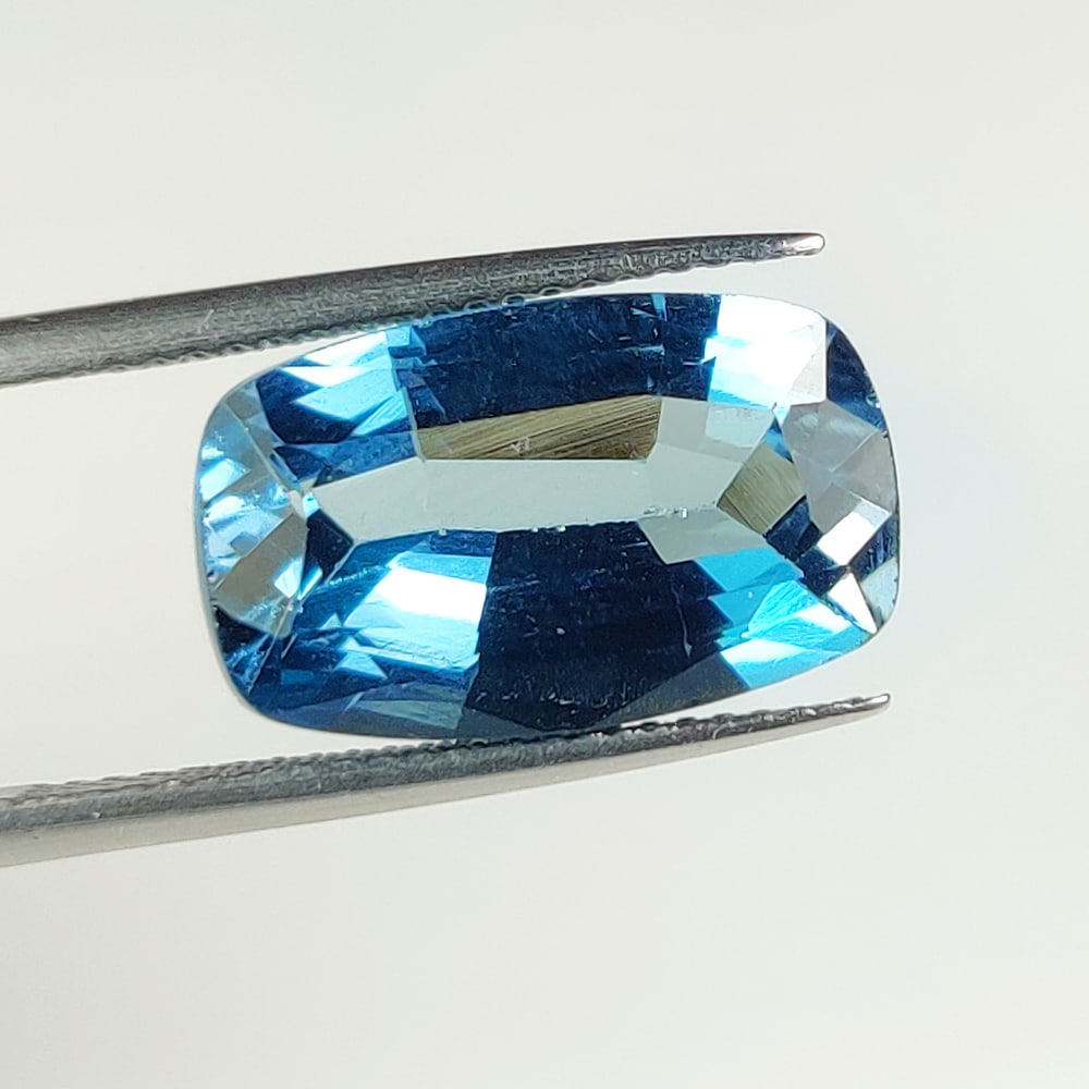 9.46 Ct Natural London Blue Topaz Cushion Cut: Weight - 9.46 Ct / Dimensions - 16.00 x 9.80 x 6.60 mm / Shape & Cut - Cushion Cut / Color - Blue / Transparency - Transparent / Comments - Irradiated