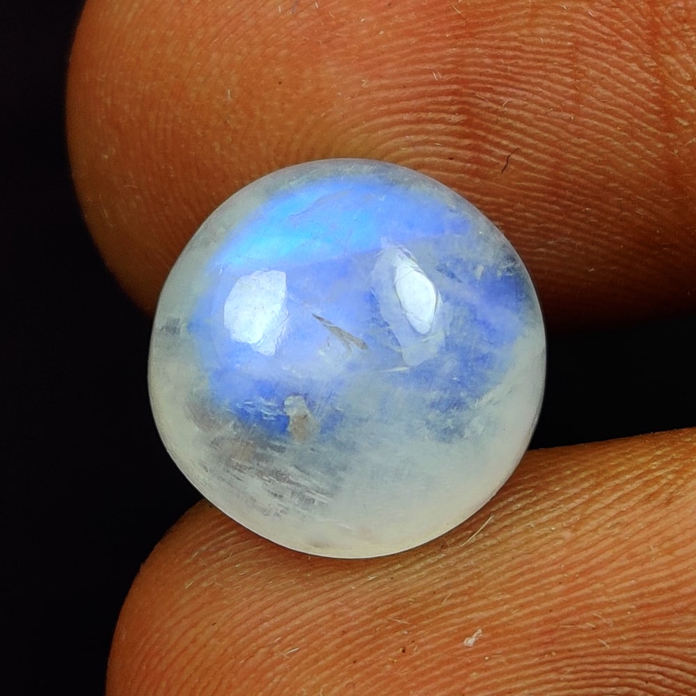 6.15 Ct Natural Blue Tint Moonstone Round Cab: Weight - 6.15 Ct / Size - 11.80 x 11.80 x 5.60 mm / Shape - Round Cab / Clarity - Semi-Transparent / Origin - India / Treatment - None