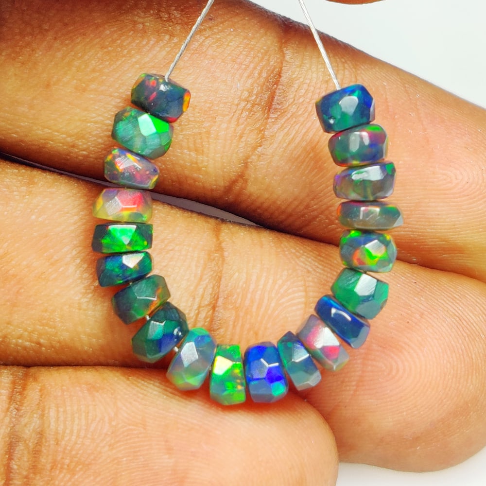 5.71 Ct Natural Black Flashing Fire Opal Round Cut Beads: Weight - 5.71 Ct / Dimensions - 4.30 - 4.60 mm / 20 Pc's / Shape - Round cut Beads / Color - Black / Clarity - Translucent / Origin - Ethiopia / Treatment - Color Cmoked