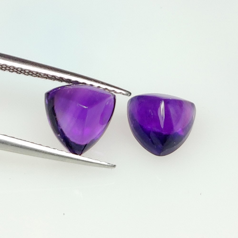 4.22 Ct Natural Purple Amethyst Trillion Cab Pair: Weight - 4.22 Ct / Dimensions - 8.10 x 8.00 x 6.30 mm / 2 Pc's / Shape - Trillion Cab / Color - Purple / Clarity - VVS / Origin -Brazil / Treatment - Heated