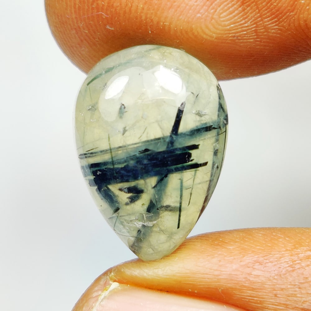 11.50 Ct Natural Green Rutile Prehnite Pear Cab: Weight - 11.50 Ct / Dimensions - 17.20 x 11.90 x 6.60 mm / Shape - Pear Cab / Clarity - Semi Transaprent / Origin - Norway / Comments - None