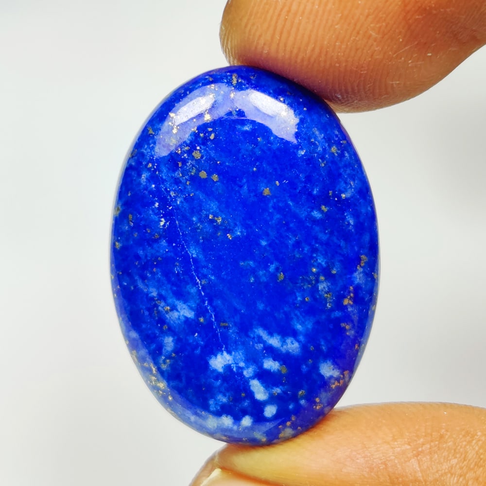 24.47 Ct Natural Blue Lapis Lazuli OVal Cab: Weight - 24.47 Ct / Size - 28.00 x 19.30 x 5.10 mm / Shape - Oval Cab / Clarity - Opaque / Origin - Afghanisthan / Treatment - None