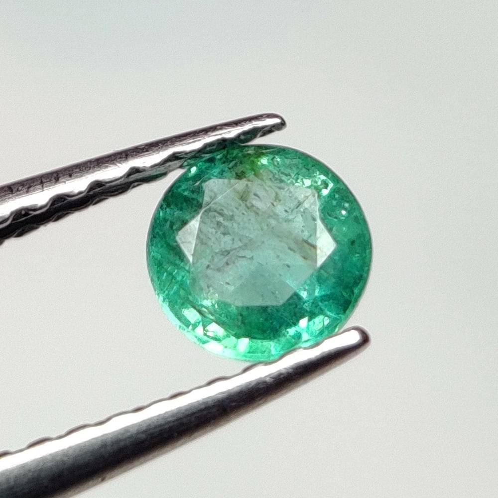0.43 Ct Natural Zambian Green Emerald Round Cut: Weight - 0.43 Ct / Dimensions - 4.80 x 4.80 x 3.00 mm / Shape - Round Cut / Color - Green / Clarity - SI / Origin - Zambia / Treatment - Natural Emeralds are commonly enhanced by oil