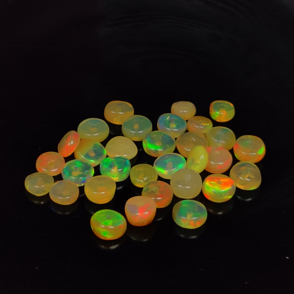 6.35 Ct Natural Multicolor Welo Opal Top Fire Round Beads: Weight - 6.35 Ct / Size - 4.00 - 4.50 mm / 30 Pc's / Shape - Round Beads / Color - Multicolor / Clarity - Translucent / Origin - Ethiopia / Treatment - None