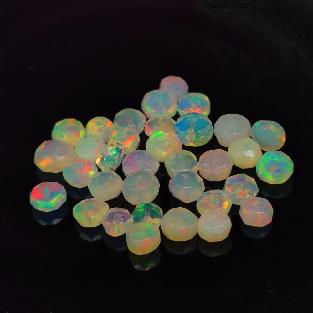 8.36 Ct Natural Multicolor Welo Opal Top Fire Round Beads: Weight - 8.36 Ct / Size - 4.00 - 5.10 mm / 34 Pc's / Shape - Round Beads / Color - Multicolor / Clarity - Translucent / Origin - Ethiopia / Treatment - None