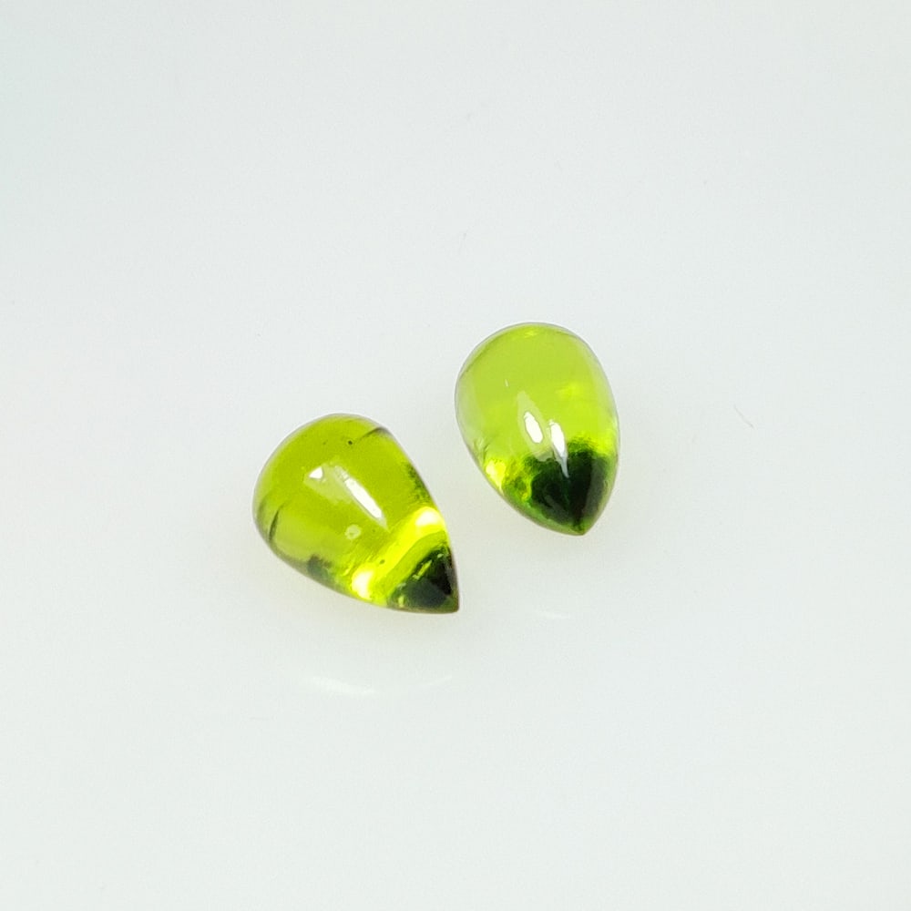 3.24 Ct Natural Green Peridot Pear Drop Pair: Weight - 3.24 Ct / Dimensions - 7.70 x 5.30 x 5.30 mm / 2 Pc's / Shape - Pear Drop / Color - Green / Clarity - VVS / Origin - Pakistan / Treatment - None