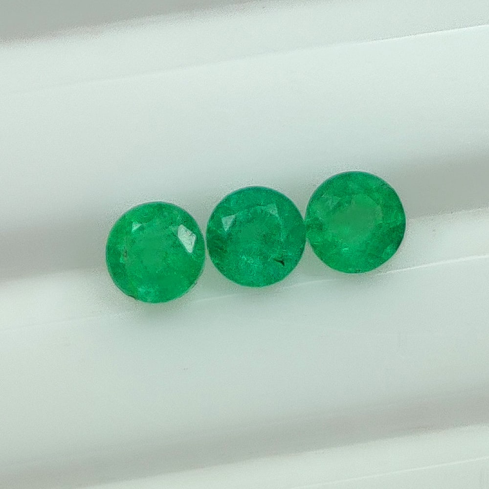 0.62 Ct Natural Zambian Green Emerald Round Cut Set: Weight - 0.62 Ct / Dimensions - 3.50 - 3.60 mm / 3 Pc's / Shape - Round Cut / Color - Green / Clarity - SI / Origin - Zambia / Treatment - Natural Emeralds are commonly enhanced by oil