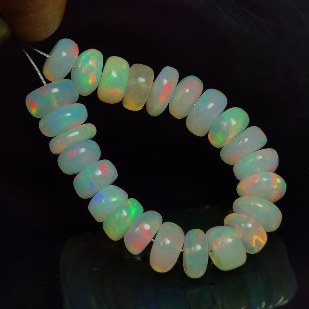 14.76 Ct Natural Multicolor Welo Opal Top Fire Round Beads: Weight - 14.76 Ct / Size - 6.20 - 6.80 mm / 24 Pc's / Shape - Round Beads / Color - Multicolor / Clarity - Translucent / Origin - Ethiopia / Treatment - None