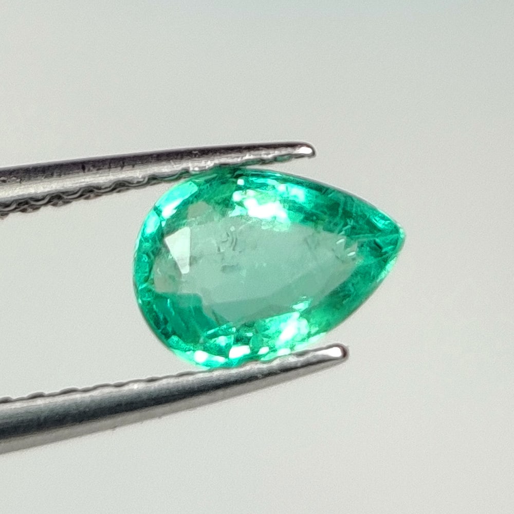 0.66 Ct Natural Zambian Emerald Pear Cut: Weight - 0.66 Ct / Dimensions - 7.20 x 5.10 x 3.10 mm / Shape - Pear Cut / Color - Green / Clarity - SI / Origin - Zambia / Treatment - Natural Emeralds are commonly enhanced by oil