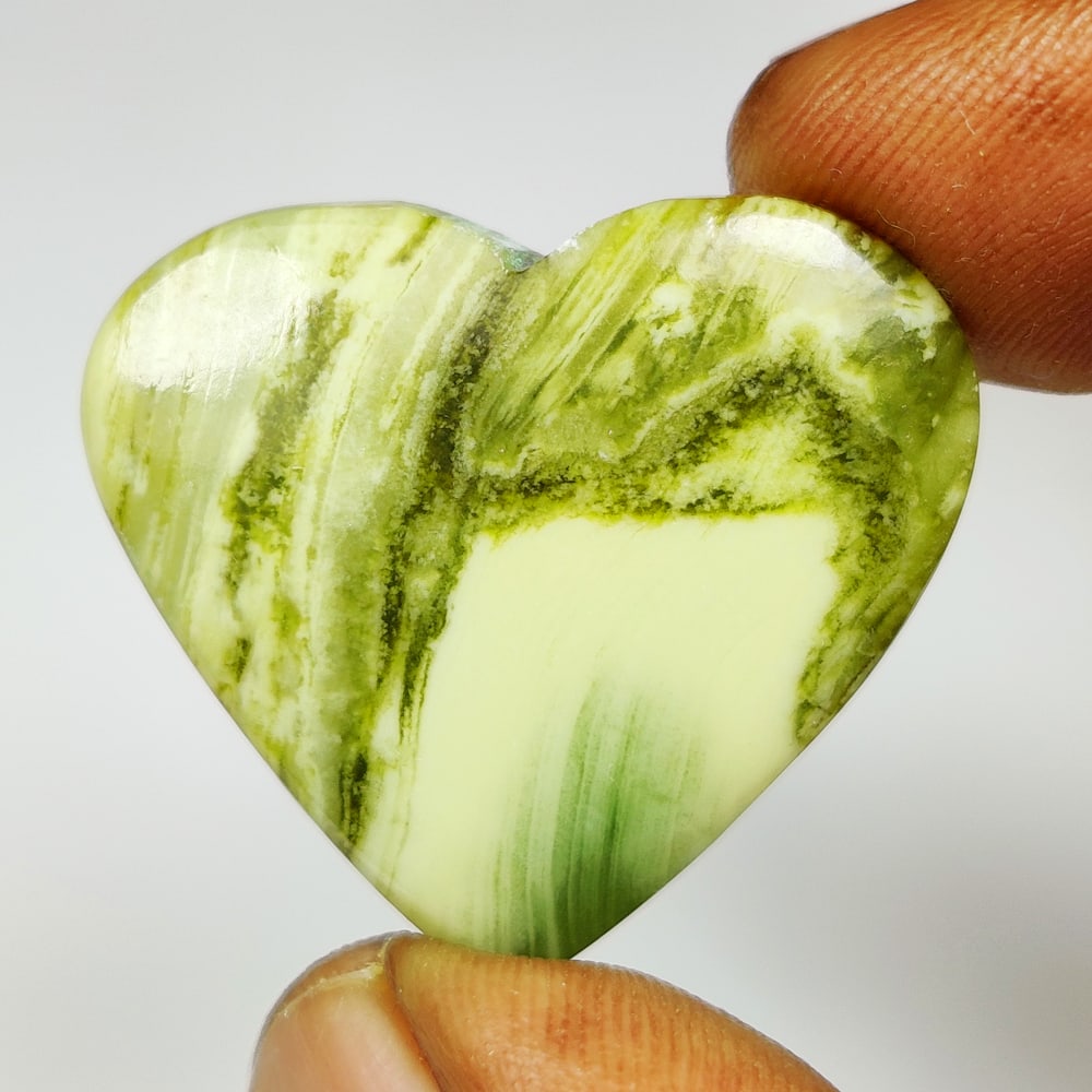 24.57 Ct Natural Green Serpentine Heart Cab: weight - 24.57 Ct / Size - 29.00 x 27.00 x 5.10 mm / Shape - Excellent Heart Cab / Origin - Brazil / Treatment - None
