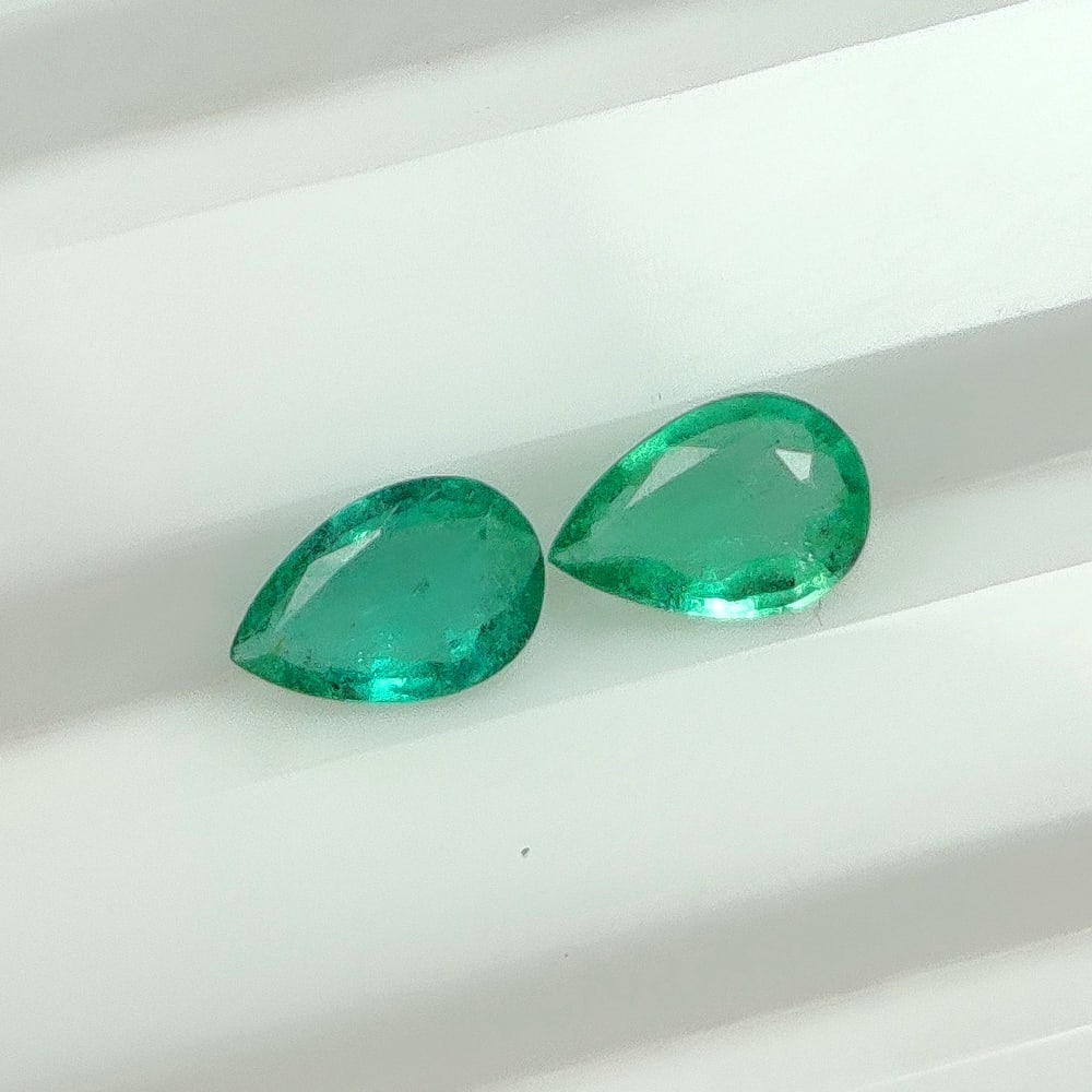 0.65 Ct Natural Zambian Emerald Pear Cut Pair: Weight - 0.65 Ct / Dimensions - 6.20 x 4.20 x 2.30 mm / 2 Pc's / Shape - Pear Cut / Color - Green / Clarity - SI / Origin - Zambia / Treatment - Natural Emeralds are commonly enhanced by oil