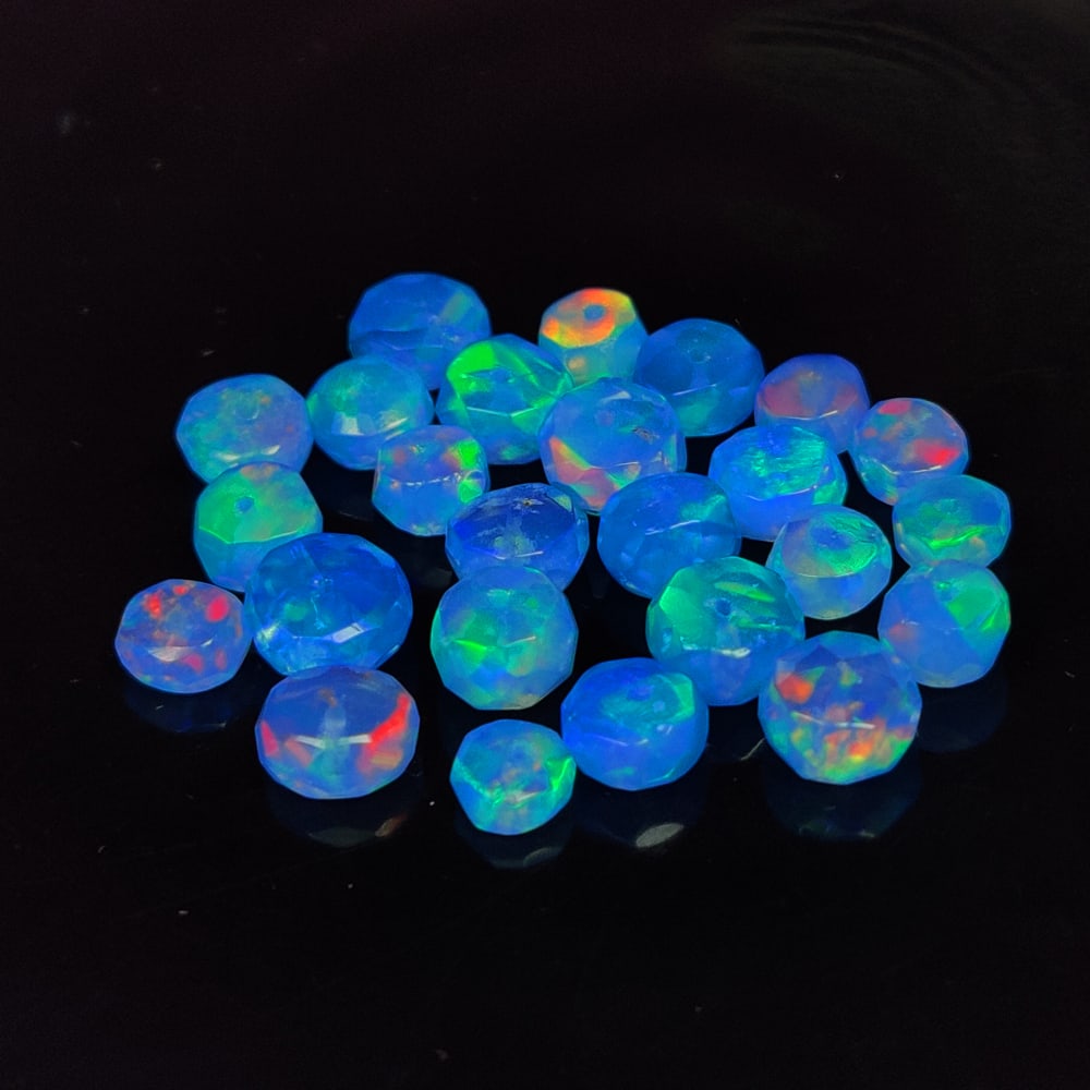 9.29 Ct Natural Blue Fire Opal Round Beads: Weight - 9.29 Ct / Size - 4.20 - 5.60 mm / 25 Pc's / Shape - Round beads / Color - Orange / Clarity - Translucent / Origin - Ethiopia / Treatment - Color Heated