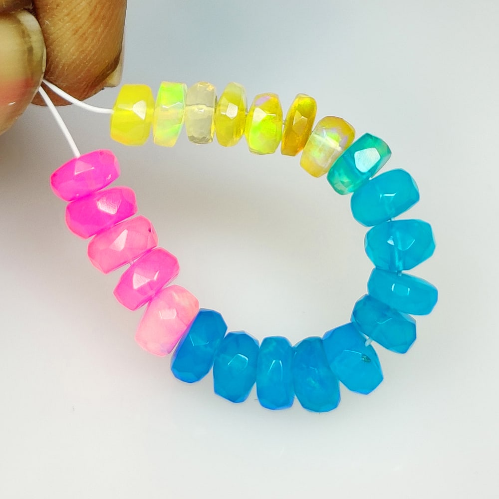 6.50 Ct Natural Multicolor Fire Opal Round Beads: Weight - 6.50 Ct / Size - 4.30 - 5.20 mm /22 Pc's / Shape - Round Beads / Color - Multicolor / Clarity - Translucent / Origin - Ethiopia / Treatment - Color Heated