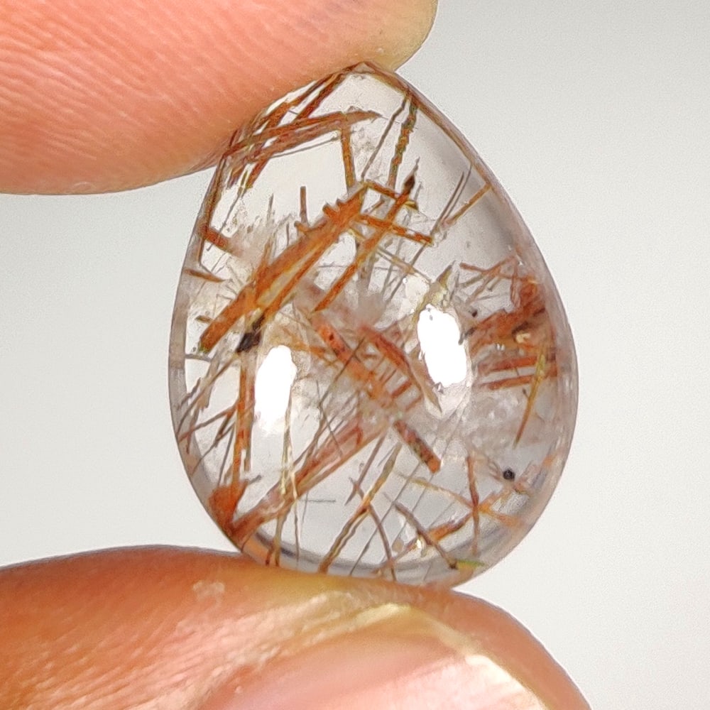 8.82 Ct Natural Rutile Quartz Pear Cab: Weight - 8.82 Ct / Dimensions - 16.20 x 12.10 x 6.80 mm / Shape & Cut - Pear Cab / Transparency - Transaprent / Origin - Norway / Comments - None