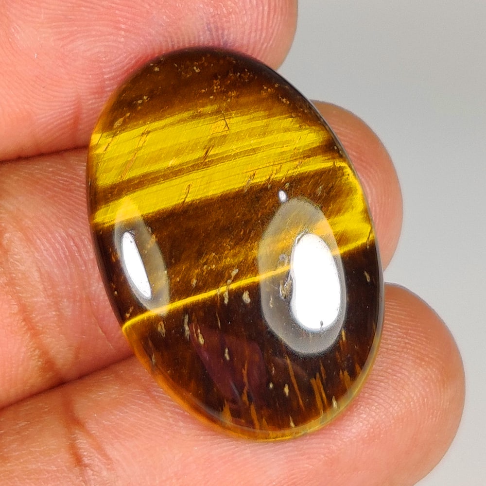 21.77 Ct Natural Tiger Eye OVal Cab (1 of 2)
