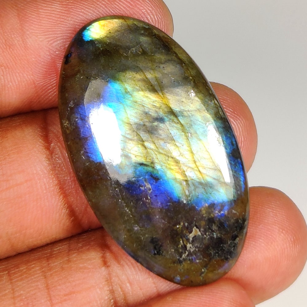 36.67 Ct Natural Labradorite Oval Cab: Weight - 36.67 Ct / Size - 37.00 x 21.00 x 5.90 mm / Shape - Oval Cab / Clarity - Opaque / Origin - Africa / Treatment - None