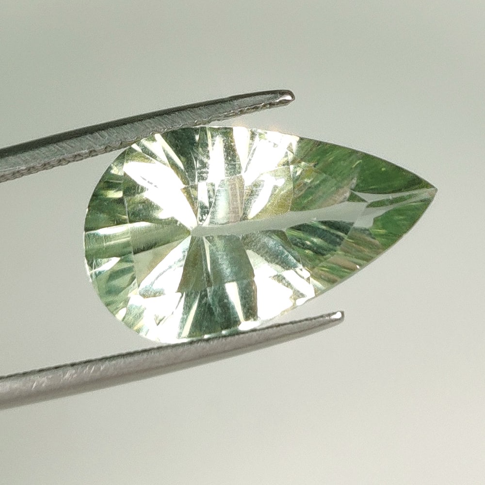 7.82 Ct Natural Green Amethyst Pear Concave Cut: Weight - 7.82 Ct / Dimensions - 19.00 x 11.50 x 7.00 mm / Shape - Pear Cut / Color - Green / Clarity - VVS / Origin -Brazil / Treatment - Heated