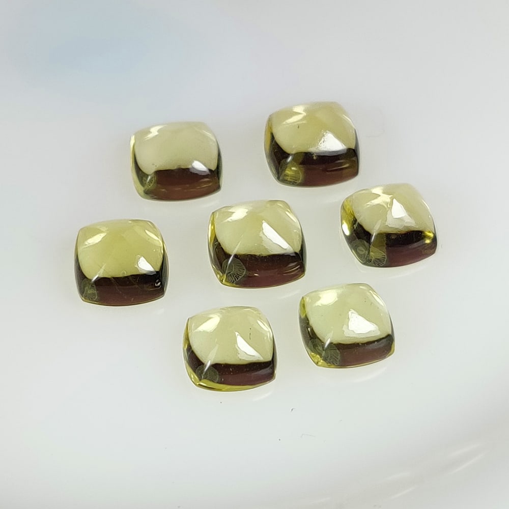 17.22 Ct Natural Lemon Quartz Cushion Cab Set: Weight - 17.22 Ct / Dimensions - 7.7x4.6 - 8.7x5.5 mm / 7 Pc's / Shape - Cushion Cab / Clarity - VVS / Origin - Brazil / Treatment - Heated