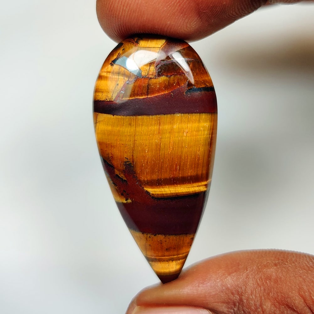 32.27 Ct Natural Tiger Eye Pear Cab (1 of 2)