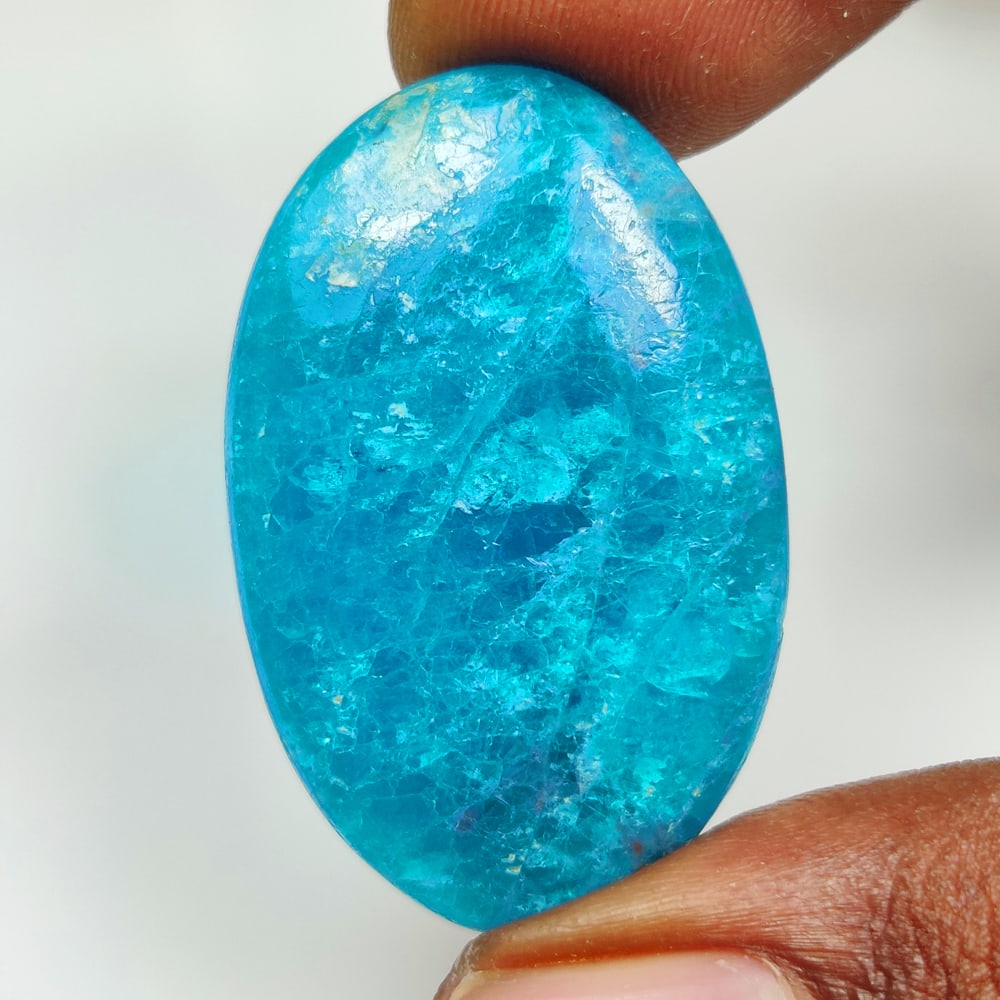41.36 Ct Natural Neon Blue Apatite Oval Cab: Weight - 41.36 Ct / Dimensions - 37.00 x 24.00 x 5.60 mm / Shape - Oval Cab / Clarity - Opaque / Origin - Brazil / Treatment - None