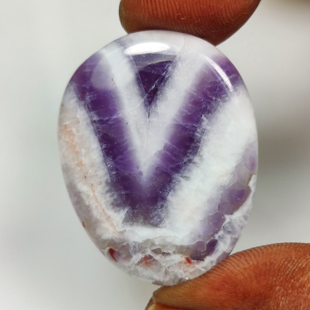 31.09 Ct Natural Chevron Amethyst Oval Cab: Weight - 31.09 Ct / Dimensions - 32.00 x 25.00 x 4.90 mm / Shape Oval Cab / Clarity - Opaque / Origin - Brazil / Treatment - None